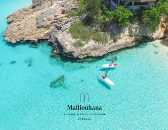 1  Perched atop a panoramic bluff overlooking the  azure waters of the Caribbean Sea and extending